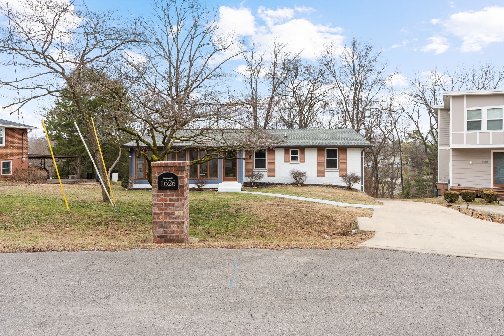 3-bed home sold in Nashville, TN 37206, 1626 Lethia Dr Single-story home at 1626 Lethia Dr, Nashville, TN 37206, with white brick and tan siding, a brick address pillar and a covered front entry
