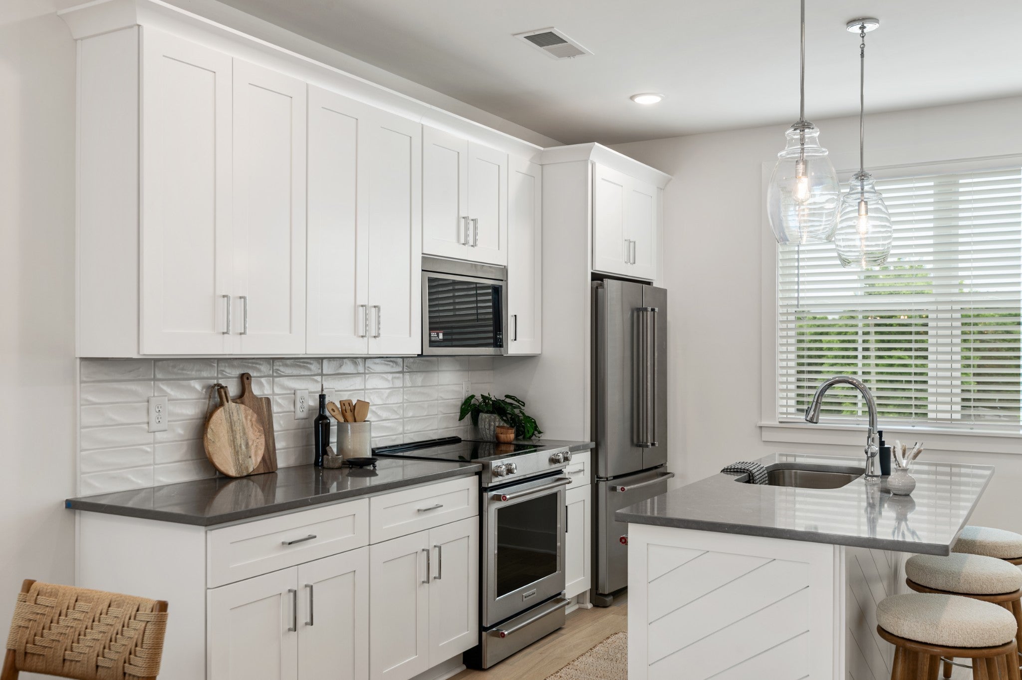 2-bed condo for sale in Nashville, TN 37216, 219 Straton Ln Kitchen with white shaker cabinets, gray countertops, a textured tile backsplash and a window over the sink