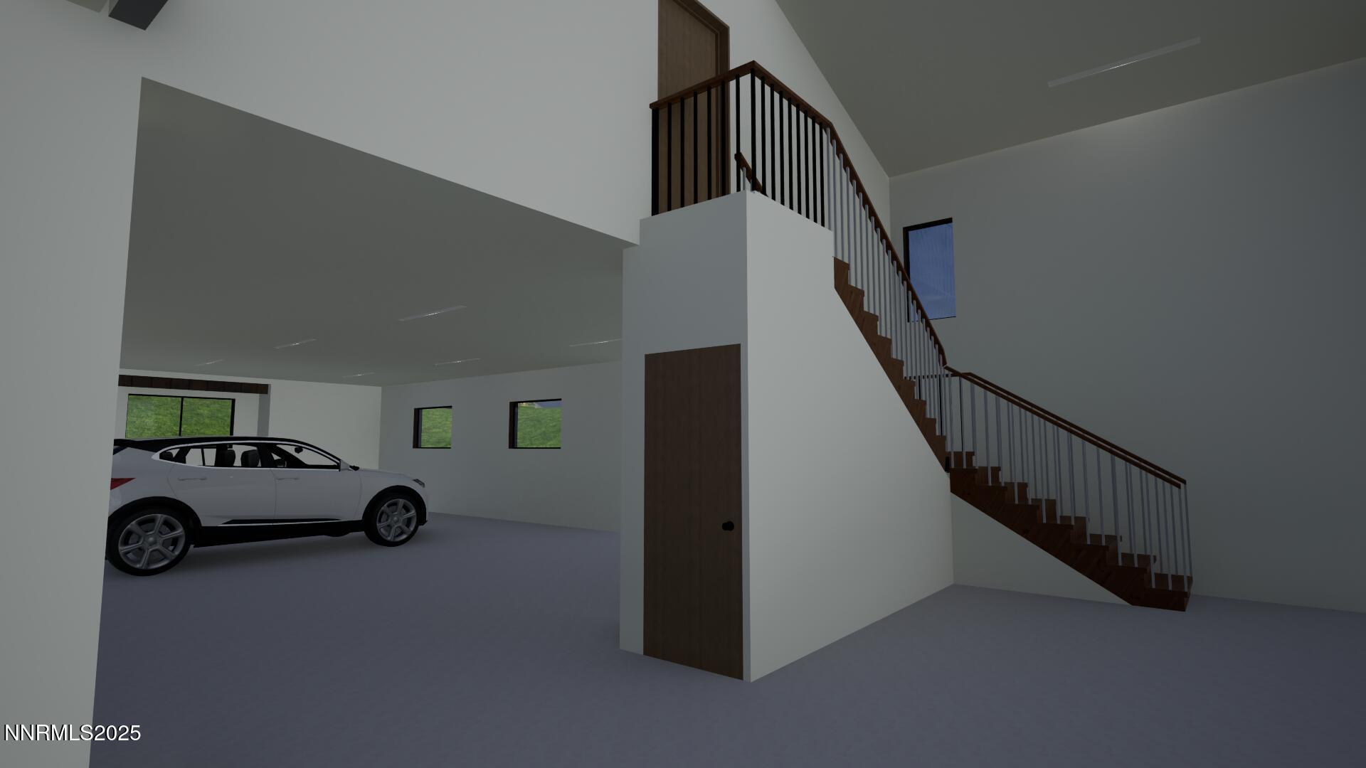 Garage view with loft stairs