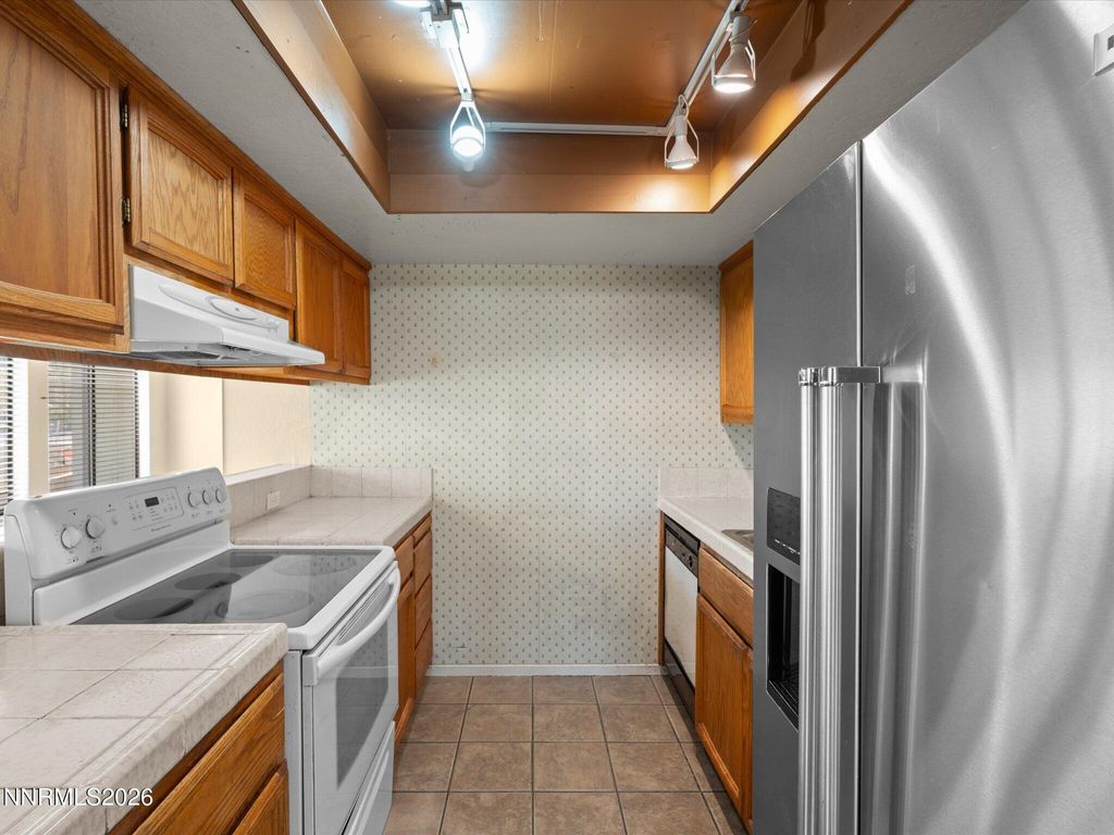 Photo of 2845 Idlewilld Dr Dr #102, Reno, NV 89509 (MLS # 260003689)