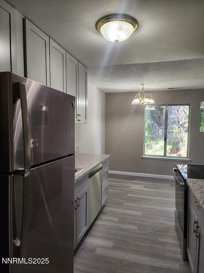 kitchen from entry to refrigerator side