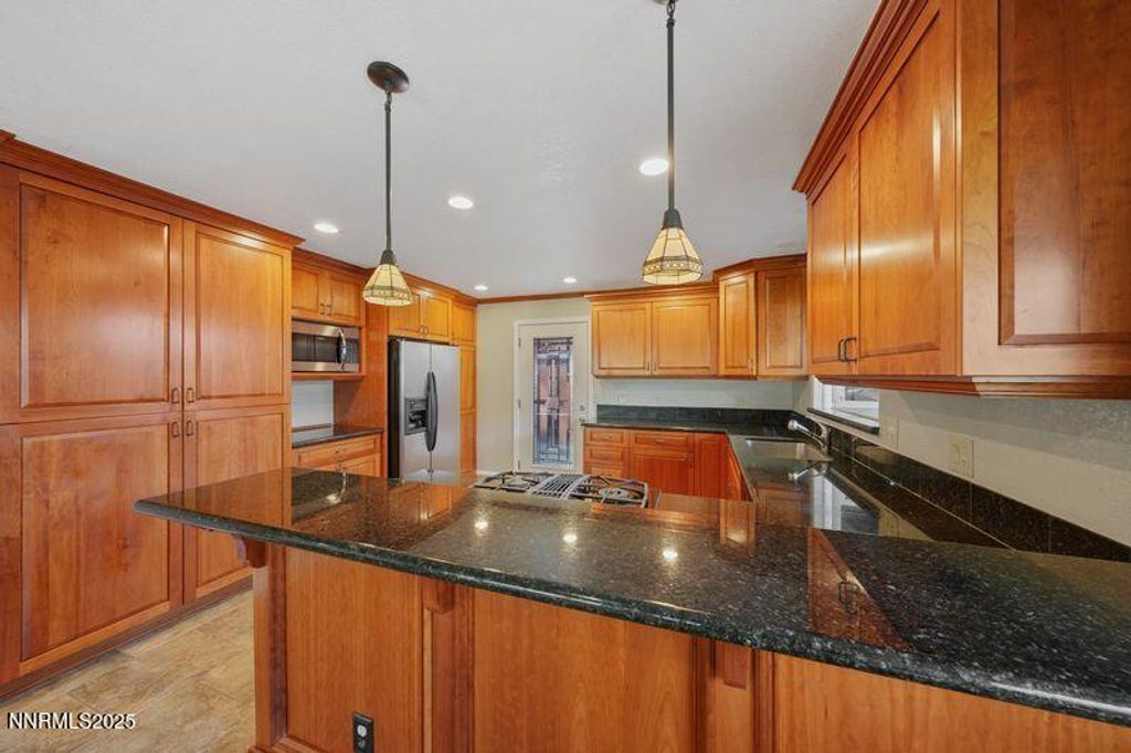 Photo of 3533 E Hidden Valley Drive, Reno, NV 89502 (MLS # 250059314)