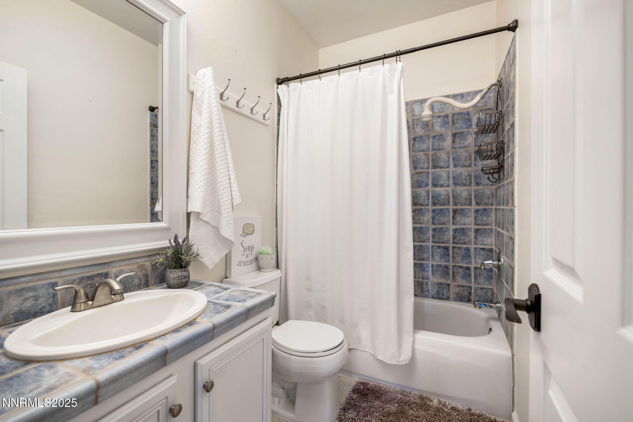 The hall bathroom features a sun tunnel.