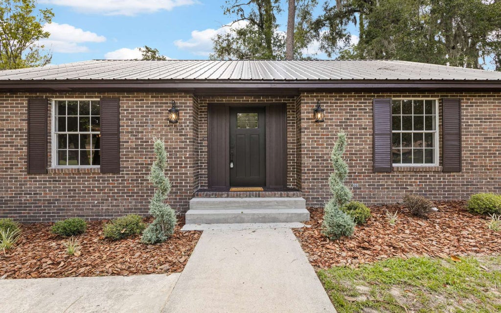 Photo of 836 SW Lake Montgomery Ave, Lake City, FL 32025 (MLS # 131980)