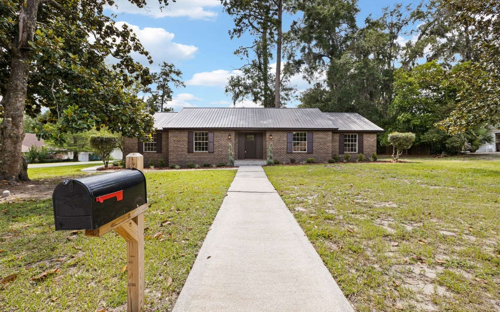 Photo of 836 SW Lake Montgomery Ave, Lake City, FL 32025 (MLS # 131980)