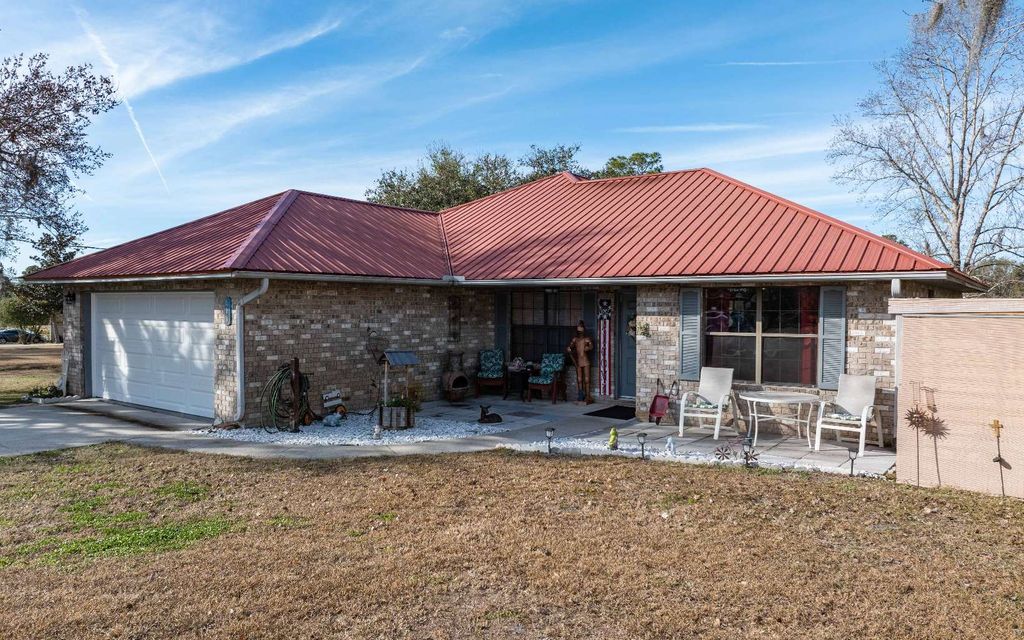 Photo of 410 SW Quail Heights Terrace, Lake City, FL 32025 (MLS # 129861)