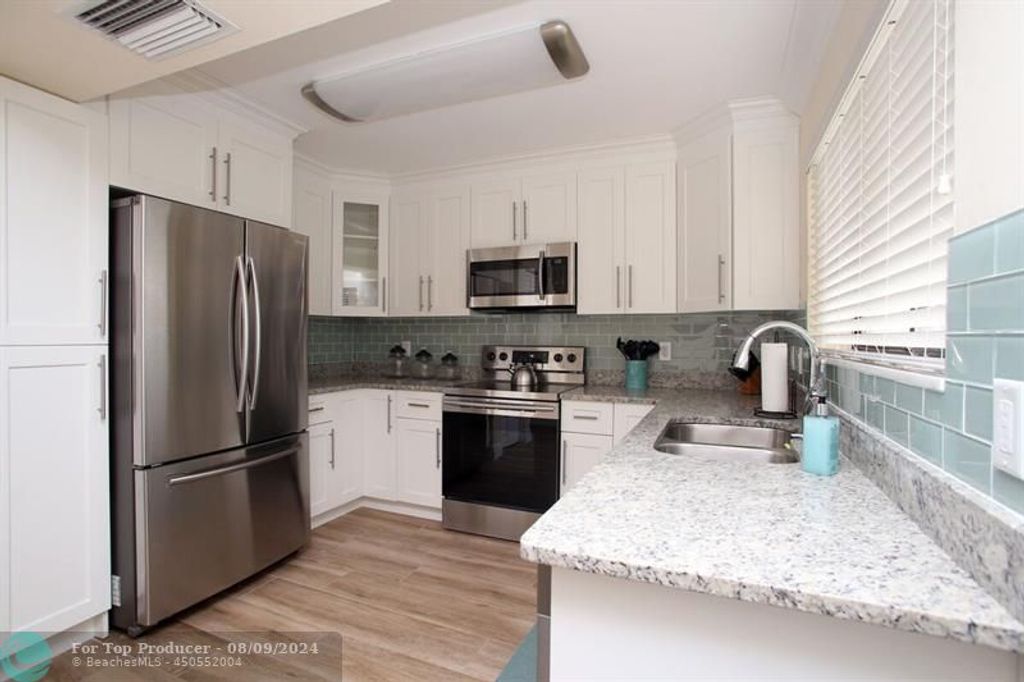 Photo of 67 Balfour Rd, Palm Beach Gardens, FL 33418 (MLS # F10455432)