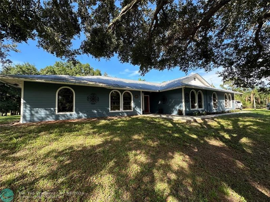 Photo of 6757 SW Travers St, Palm City, FL 34990 (MLS # F10449345)