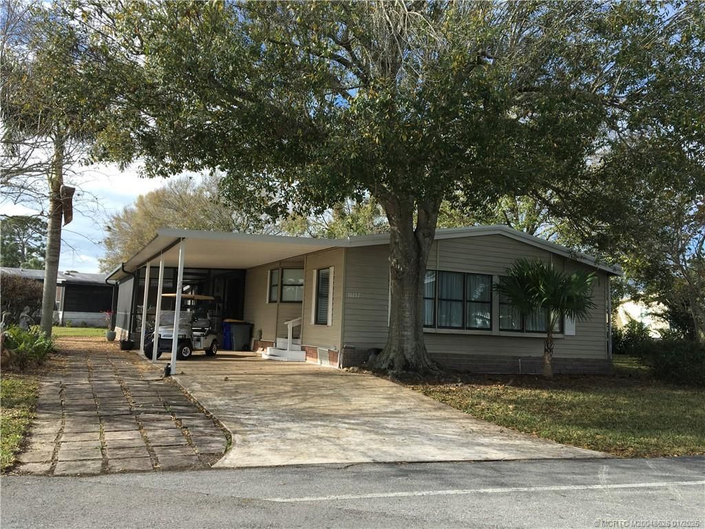 Photo of 16137 SW Indianwood Cir Cir, Indiantown, FL 34956 (MLS # M20048626)