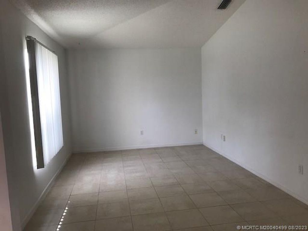 Photo of 1180 SE Ladner Street, Port Saint Lucie, FL 34983 (MLS # M20040499)