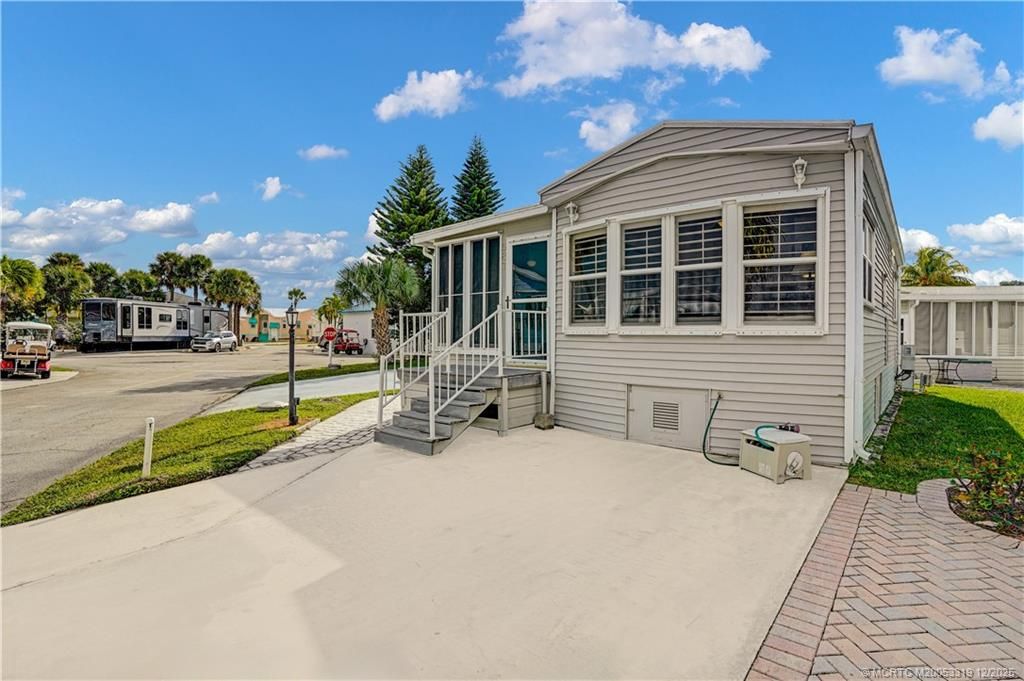 Photo of 587 Nettles Boulevard, Jensen Beach, FL 34957 (MLS # M20053319)