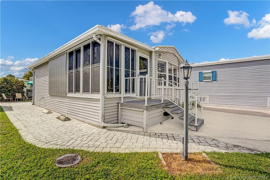 Photo of 587 Nettles Boulevard, Jensen Beach, FL 34957 (MLS # M20053319)