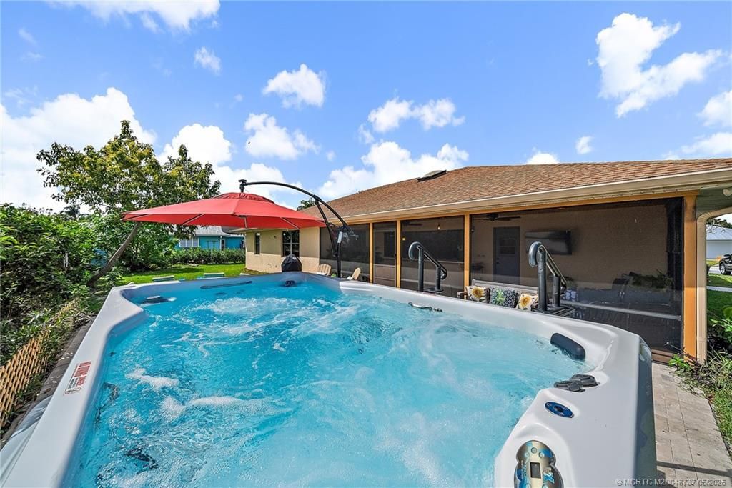 Photo of 1927 NE San Carlos Calle, Jensen Beach, FL 34957 (MLS # M20048737)