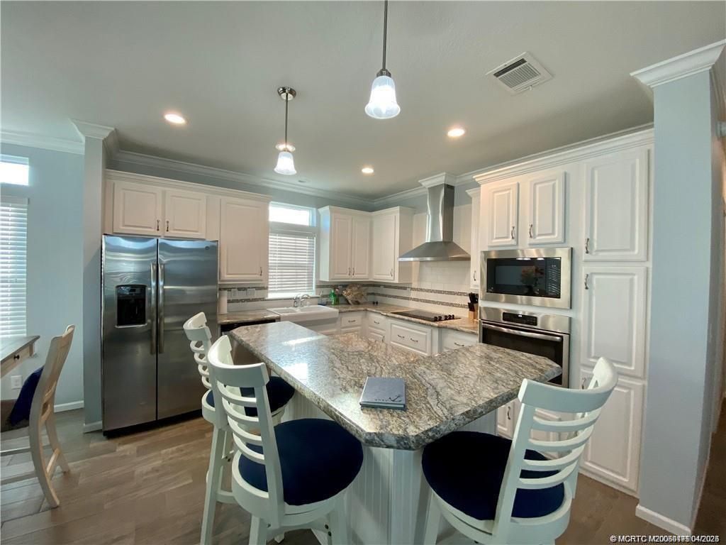 Photo of 44 NE Nautical Drive, Jensen Beach, FL 34957 (MLS # M20050175)