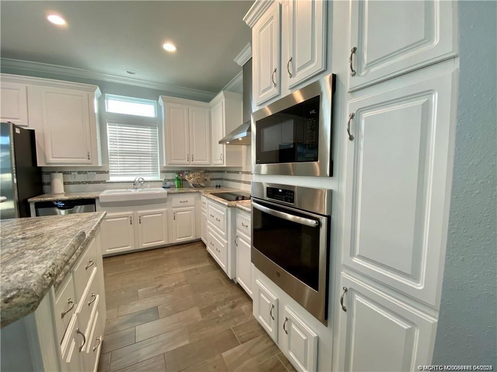 Photo of 44 NE Nautical Drive, Jensen Beach, FL 34957 (MLS # M20050175)