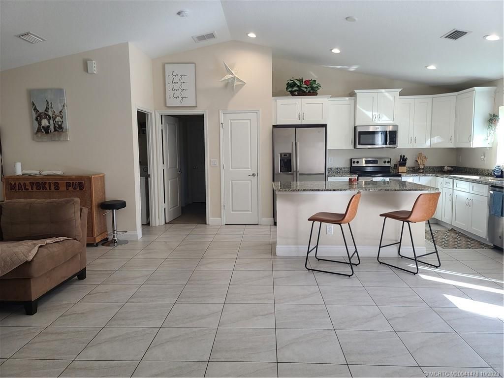 Photo of 3557 SW Kromrey Street, Port Saint Lucie, FL 34953 (MLS # M20041478)