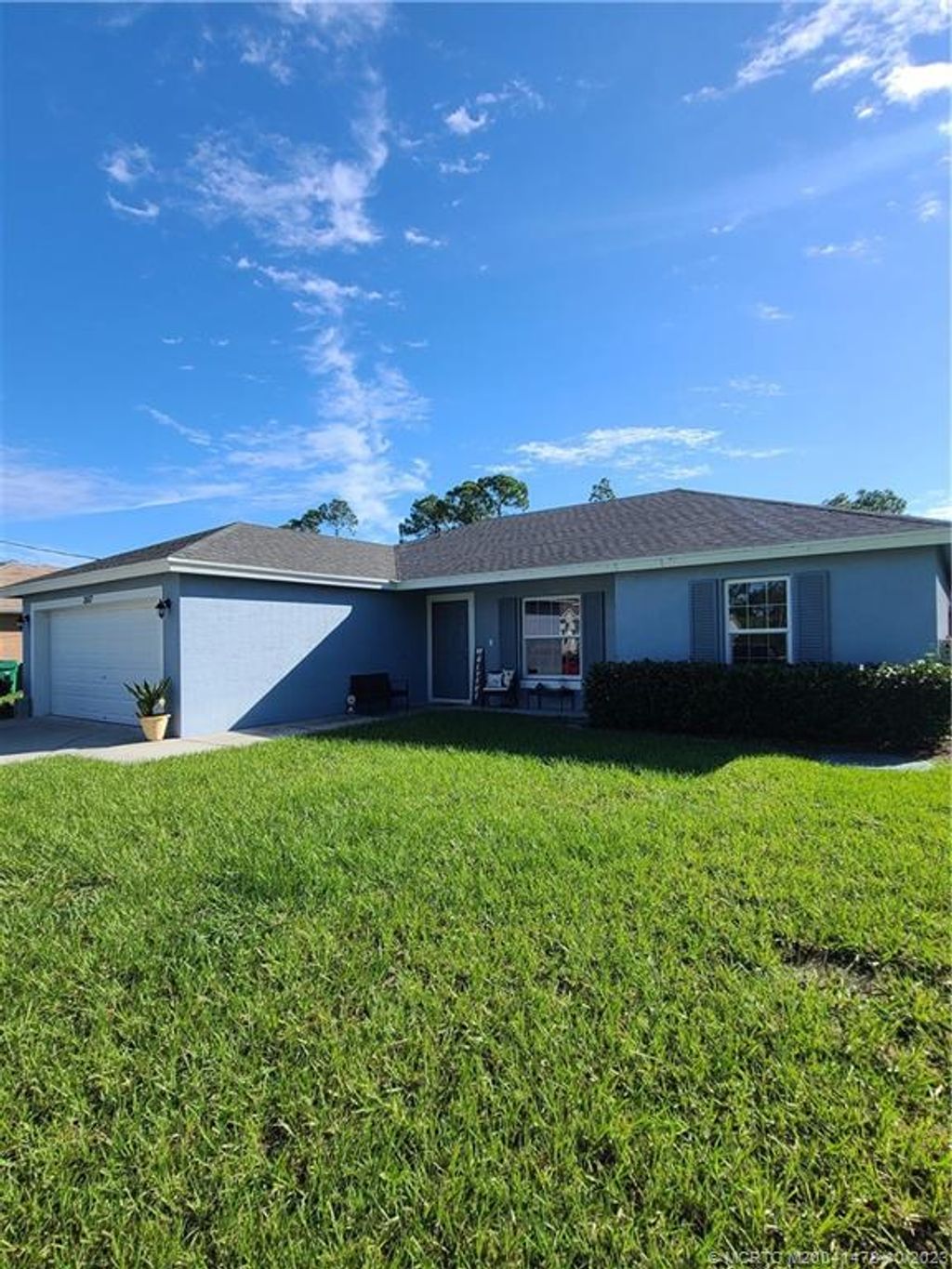Photo of 3557 SW Kromrey Street, Port Saint Lucie, FL 34953 (MLS # M20041478)