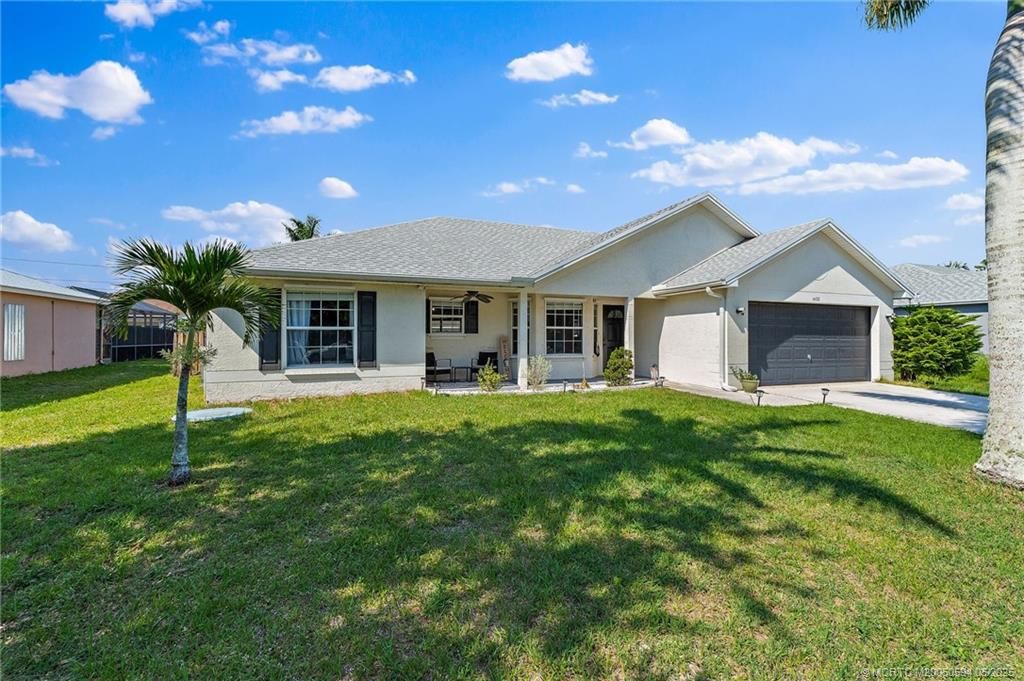 Photo of 1433 SW Flounder Lane, Port Saint Lucie, FL 34953 (MLS # M20050594)