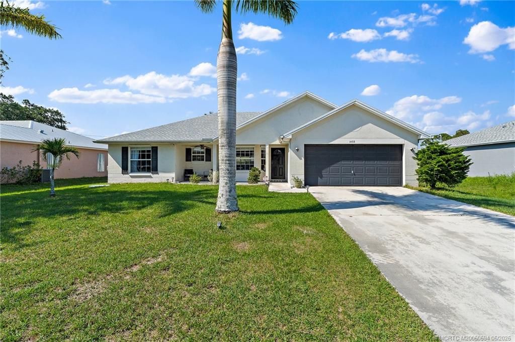 Photo of 1433 SW Flounder Lane, Port Saint Lucie, FL 34953 (MLS # M20050594)