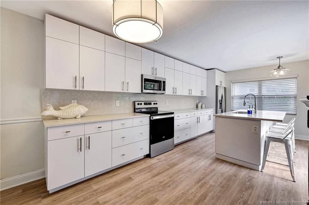 Photo of 3229 SW Sunset Trace Circle, Palm City, FL 34990 (MLS # M20042725)