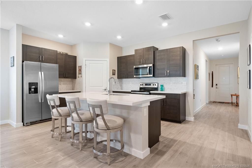 Photo of 1693 NE White Pine Terrace, Jensen Beach, FL 34957 (MLS # M20047375)