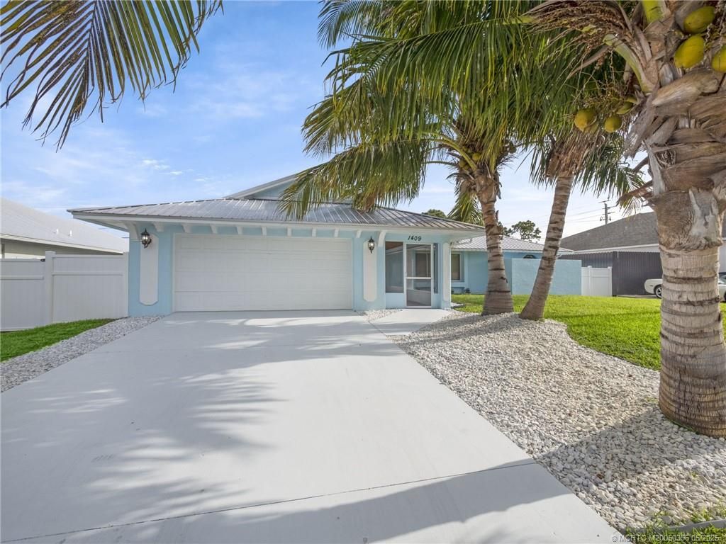 Photo of 1409 SW Aachen Avenue, Port Saint Lucie, FL 34953 (MLS # M20050396)