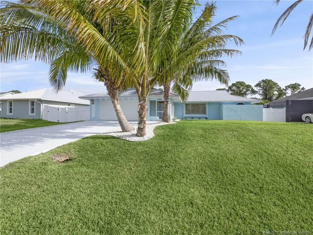 Photo of 1409 SW Aachen Avenue, Port Saint Lucie, FL 34953 (MLS # M20050396)