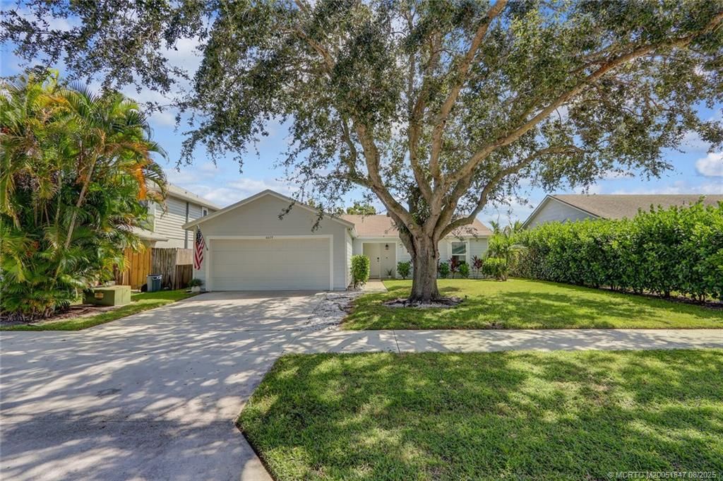 Photo of 6679 SE Raintree Avenue, Stuart, FL 34997 (MLS # M20051847)