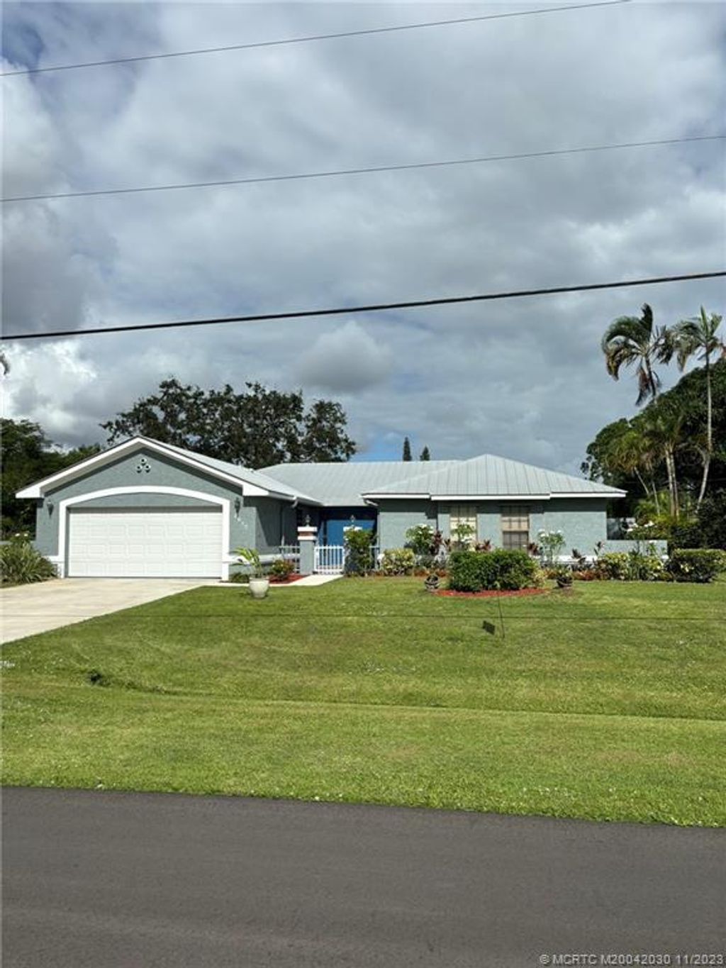 Photo of 2017 SE Van Kleff Avenue, Port Saint Lucie, FL 34952 (MLS # M20042030)