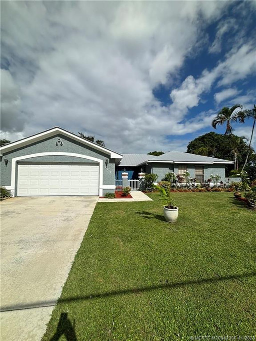 Photo of 2017 SE Van Kleff Avenue, Port Saint Lucie, FL 34952 (MLS # M20042030)