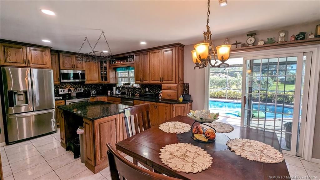 Photo of 2169 SE Dolphin Road, Port Saint Lucie, FL 34952 (MLS # M20047774)