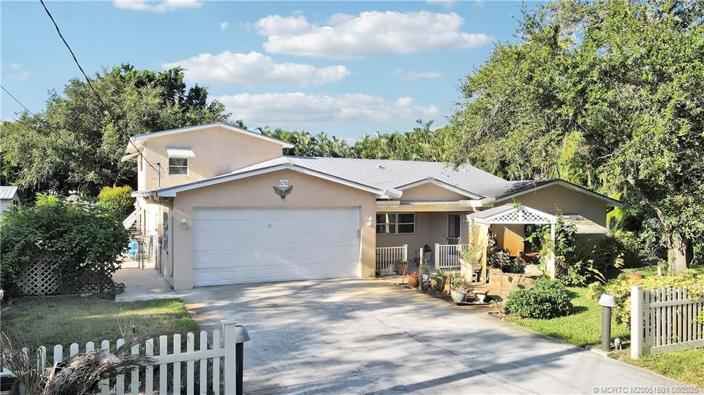Photo of 1030 SW 31st Street, Palm City, FL 34990 (MLS # M20051501)