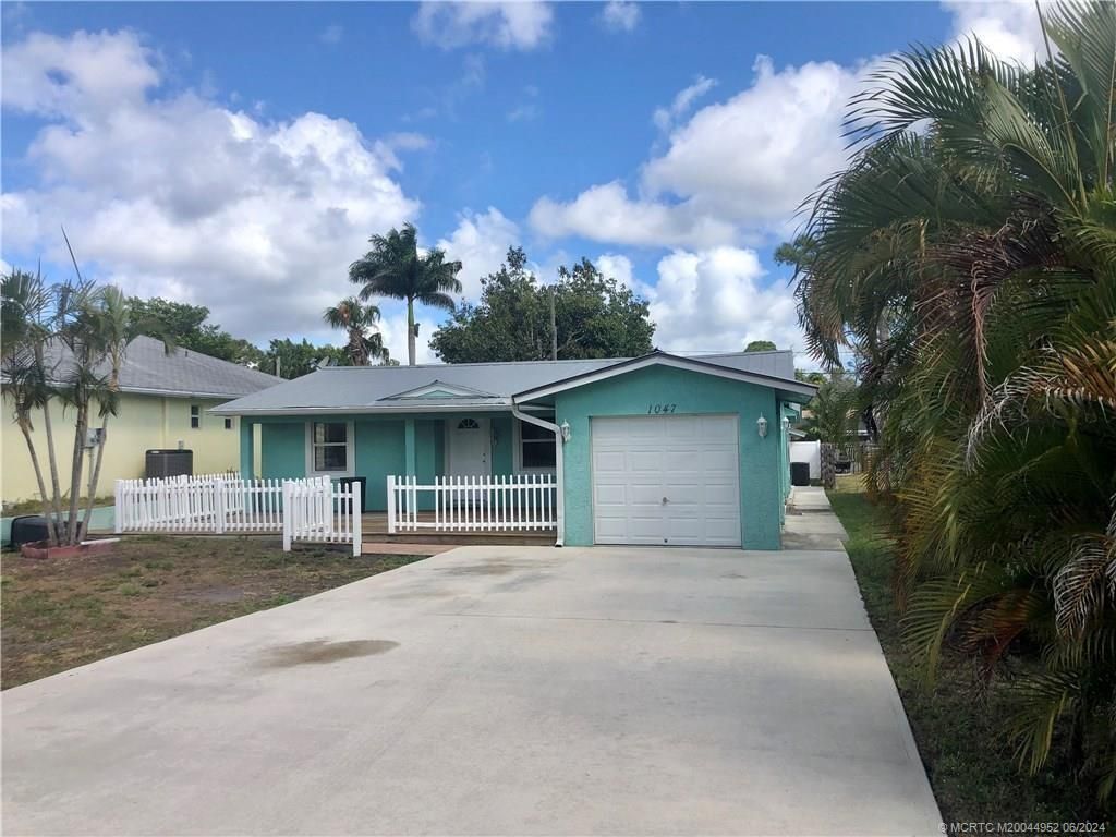 Photo of 1047 SW Spruce Street, Palm City, FL 34990 (MLS # M20044952)