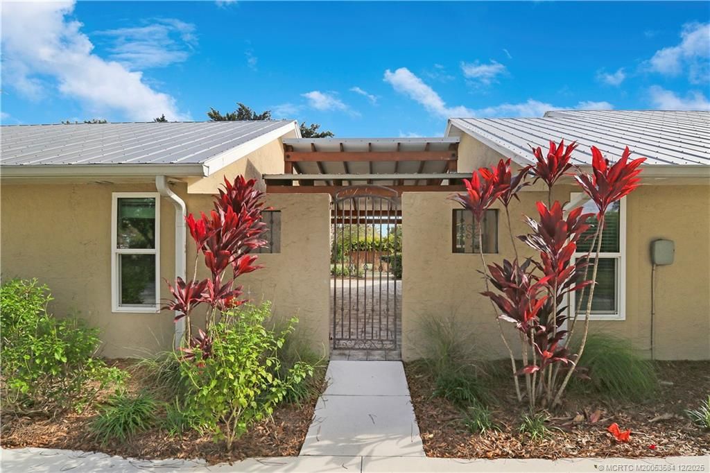 Photo of 9713 SW Santa Monica Drive, Palm City, FL 34990 (MLS # M20053584)