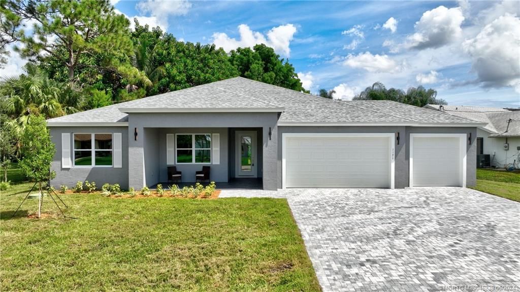 Photo of 1171 SE Palm Beach Road, Port Saint Lucie, FL 34952 (MLS # M20045239)