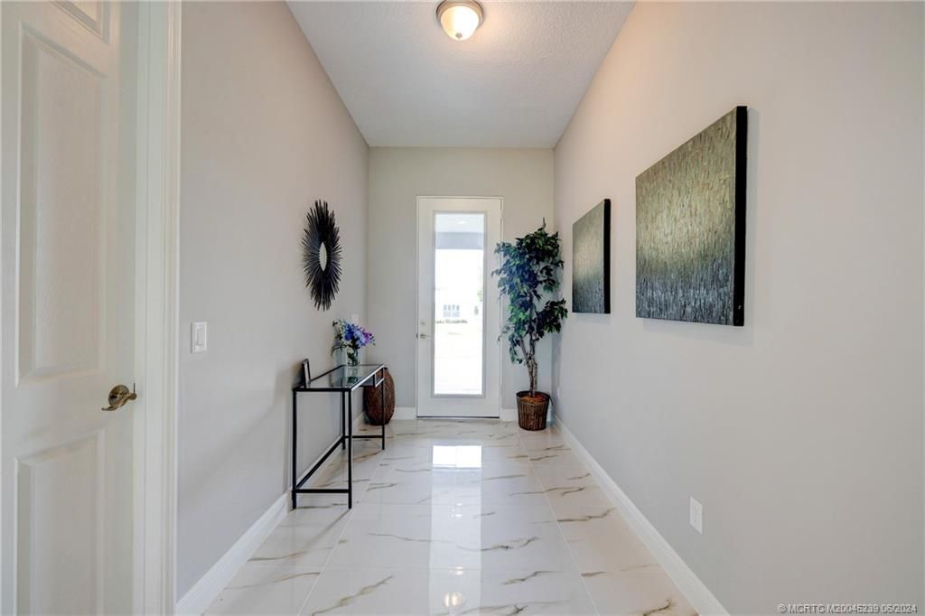 Photo of 1171 SE Palm Beach Road, Port Saint Lucie, FL 34952 (MLS # M20045239)