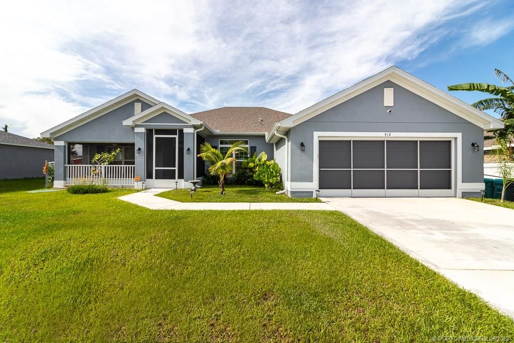 Photo of 412 SE Airview Avenue, Port Saint Lucie, FL 34984 (MLS # M20039588)