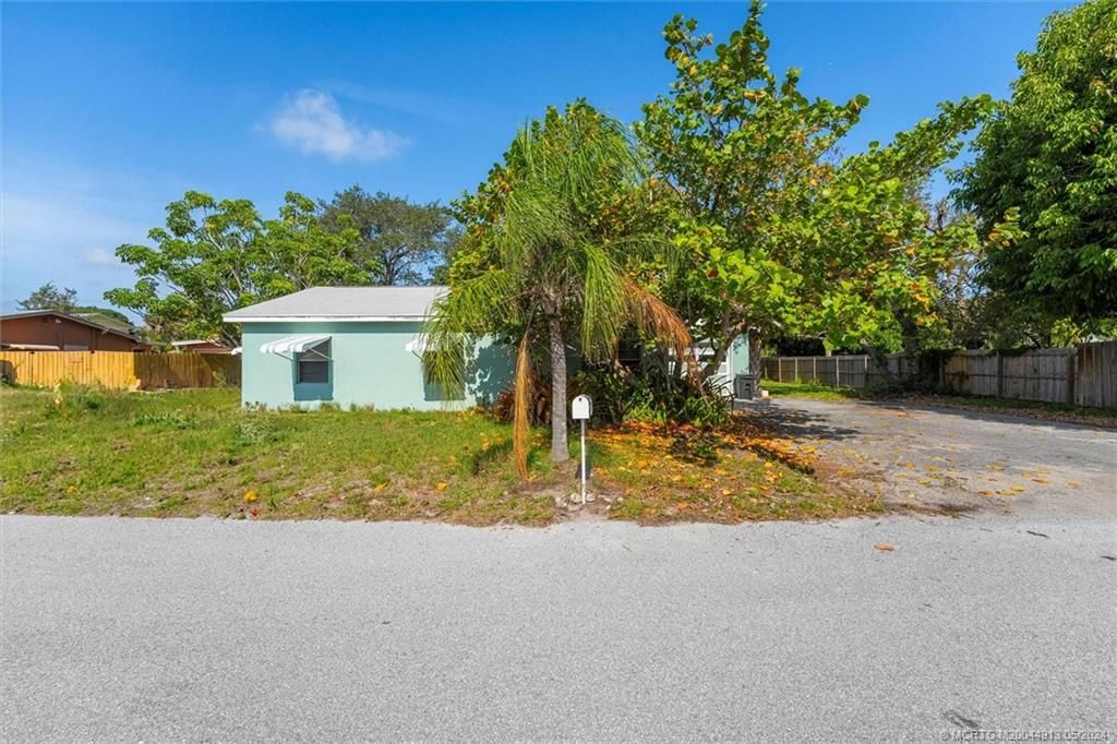 Photo of 1050 NE Wright Avenue, Jensen Beach, FL 34957 (MLS # M20044913)