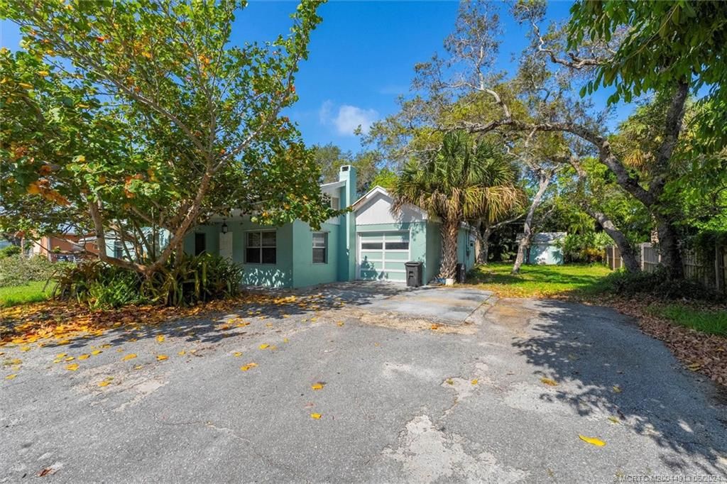 Photo of 1050 NE Wright Avenue, Jensen Beach, FL 34957 (MLS # M20044913)