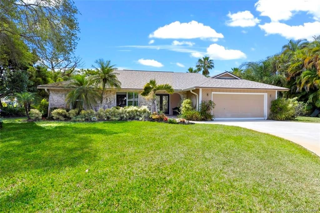 Photo of 3074 NE Loquat Lane, Jensen Beach, FL 34957 (MLS # M20054203)