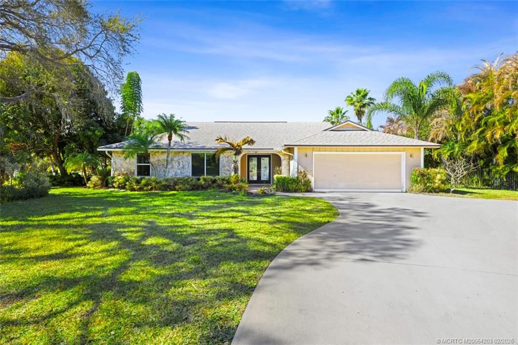 Photo of 3074 NE Loquat Lane, Jensen Beach, FL 34957 (MLS # M20054203)