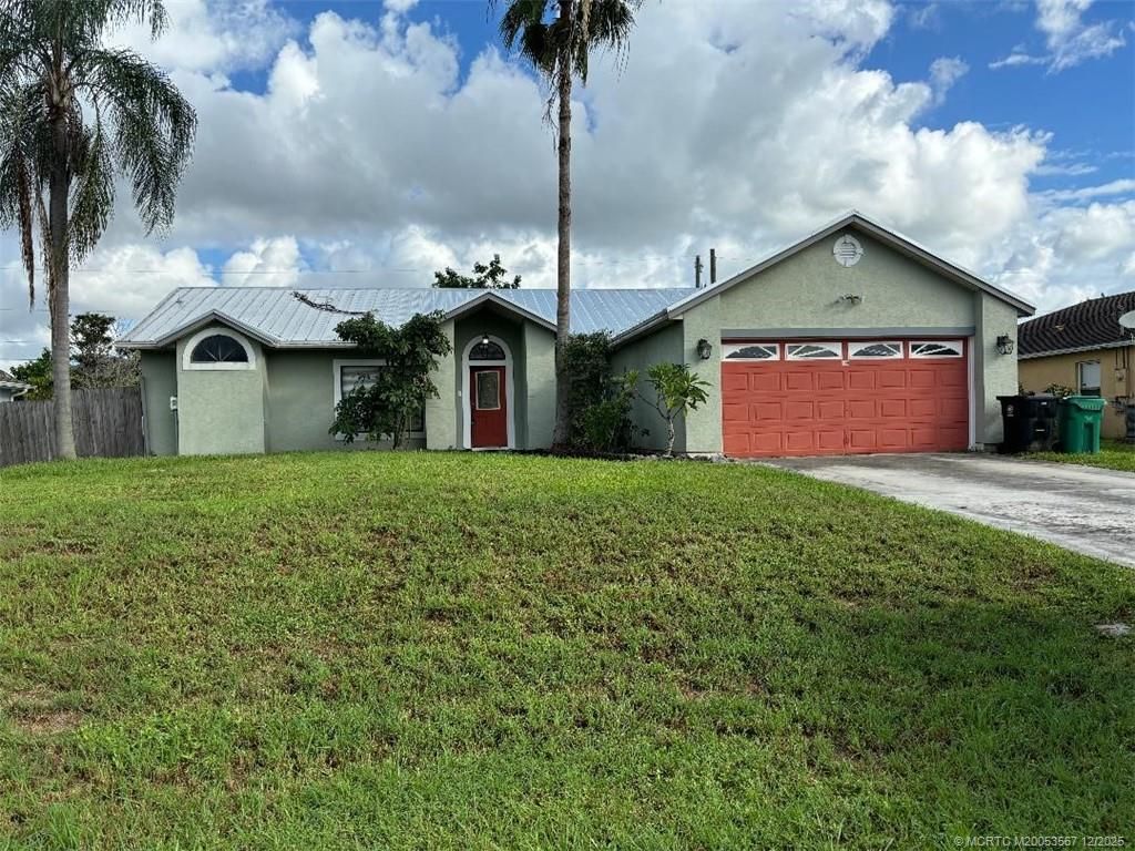Photo of 699 SW Hoffenberg Avenue, Port Saint Lucie, FL 34953 (MLS # M20053567)