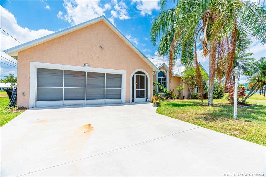 Photo of 1581 SE Dome Circle, Port Saint Lucie, FL 34952 (MLS # M20045371)