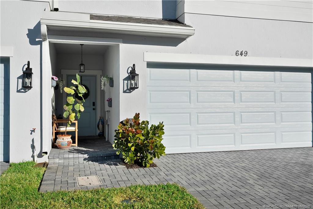 Photo of 649 NE Waters Edge Lane, Port Saint Lucie, FL 34983 (MLS # M20055875)