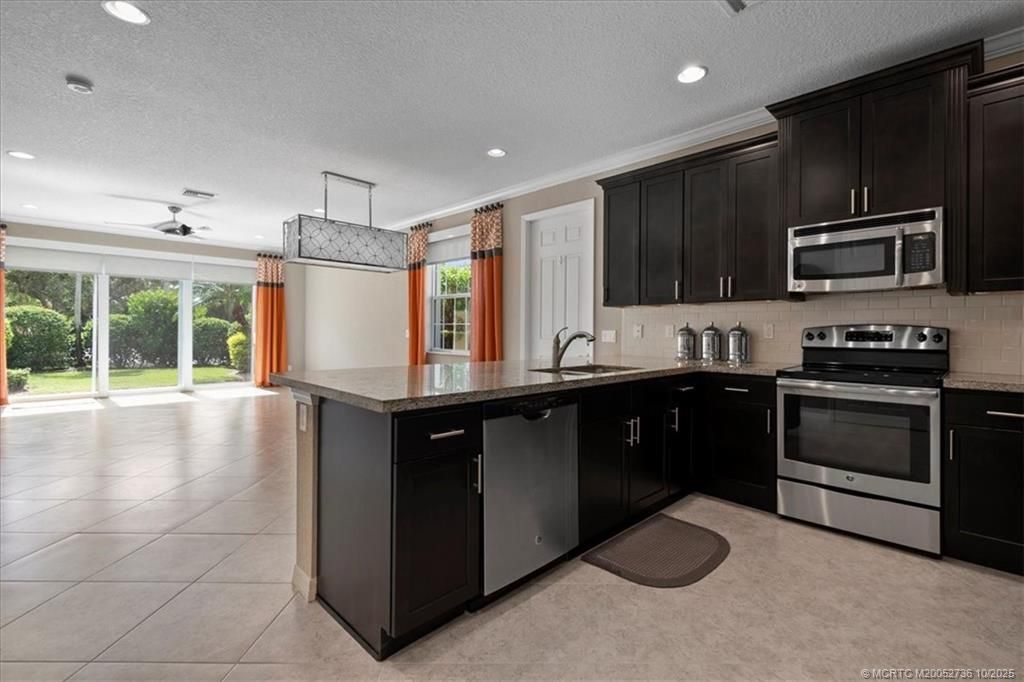 Photo of 692 SW Glen Crest Way, Stuart, FL 34997 (MLS # M20052736)