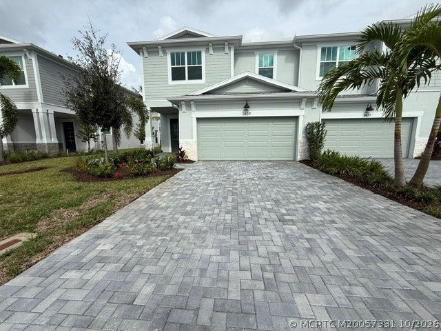Photo of 1439 NW Corteal Way, Jensen Beach, FL 34957 (MLS # M20057331)