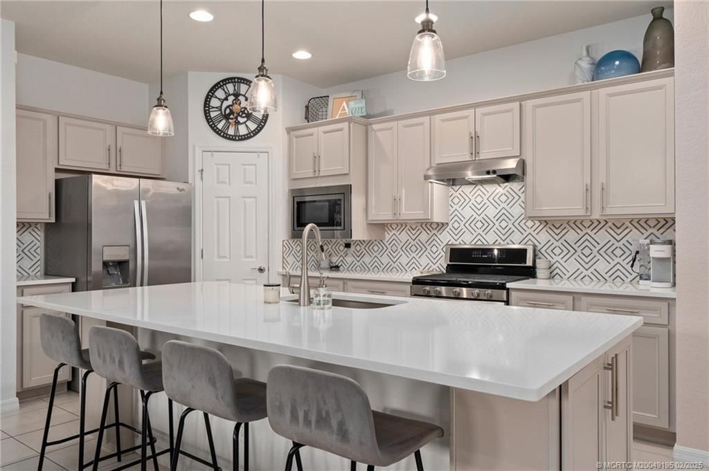 Photo of 581 SE Monet Drive, Port Saint Lucie, FL 34984 (MLS # M20049195)