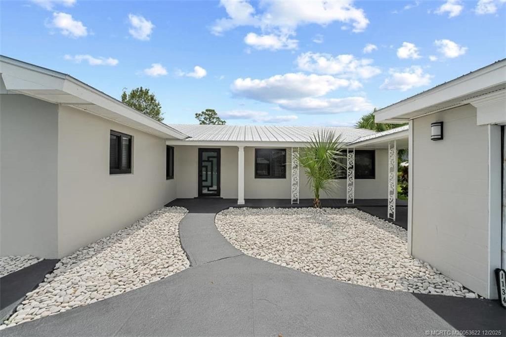 Photo of 1134 NW Spruce Ridge Drive, Stuart, FL 34994 (MLS # M20053622)