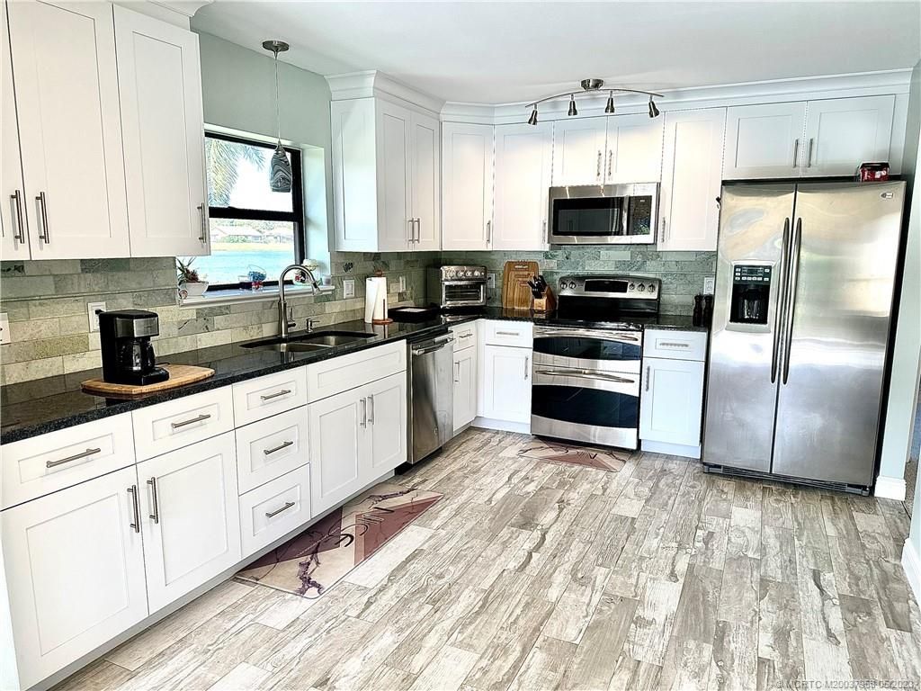 Photo of 2299 SW Bobalink Court, Palm City, FL 34990 (MLS # M20037958)