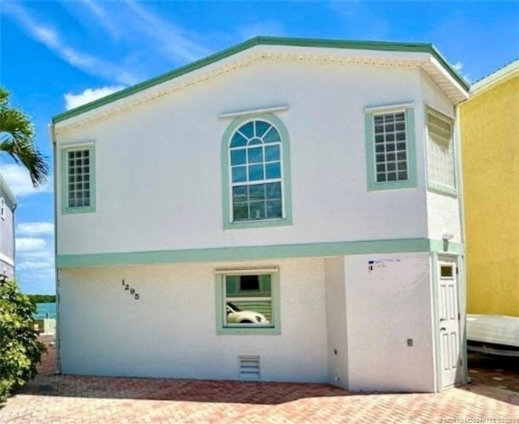 Photo of 1295 Nettles Boulevard, Jensen Beach, FL 34957 (MLS # M20048175)